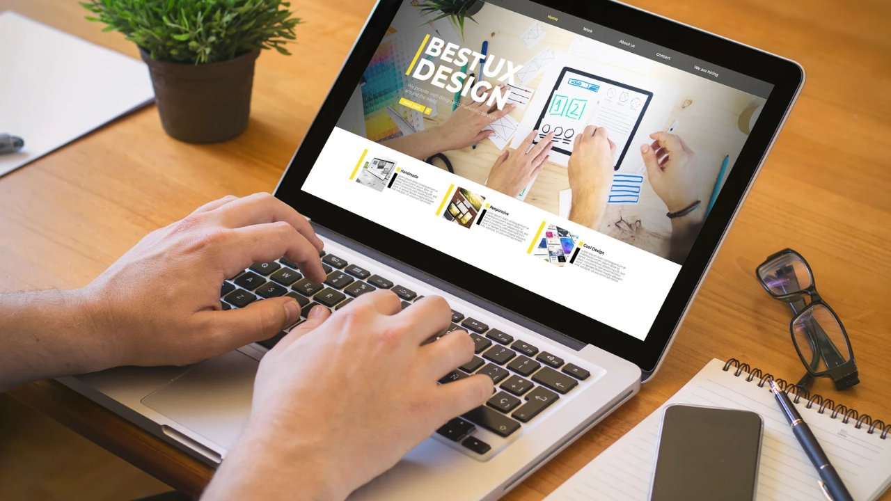 Person logging onto their computer to test that five specific things are working on their website